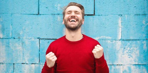 man smiling - Characteristics and Traits of a Positive Mindset: 6 Examples